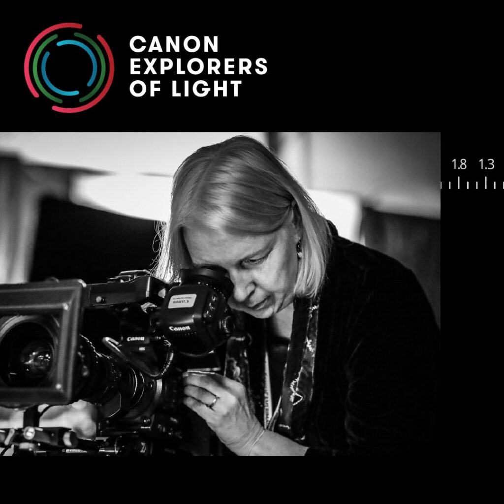 Image of Canon Explorer of Light Artist, DP Claudia Raschke looking through camera viewfinder